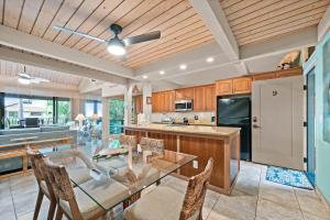 a large kitchen with a glass table and chairs at Kahana Village 9 · KHV 9 2BR Oceanfront Condo w Panoramic Maui in Kahana