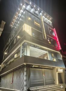 a building with lights on the side of it at Shree shyam hotel & restaurant in Mahendragarh