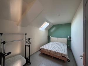 a bedroom with a bed in the corner of a room at MAISON DE VACANCES AVEC PISCINE INTERIEURE - Le Grand Champagne in Saint-Victeur +56 photos