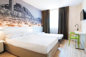 Postel nebo postele na pokoji v ubytování B&B HOTEL Alicante