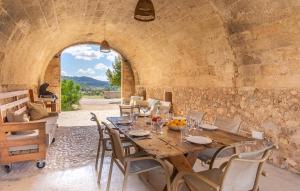 a dining room with a wooden table and chairs at Son Pons in Randa
