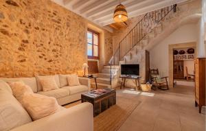 a living room with a couch and a tv at Son Pons in Randa