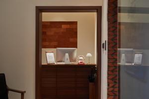 a room with a wooden door and a mirror at 泉州三品-岚厝 Lan Inn Old Town Center Quanzhou in Quanzhou +24 photos