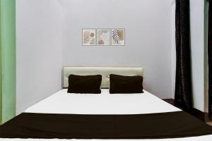 Ένα ή περισσότερα κρεβάτια σε δωμάτιο στο Hotel O Laddu Hotel