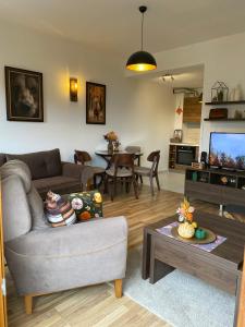 a living room with a couch and a table at Moun2 in Mavrovo
