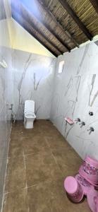 a bathroom with a toilet in a room at White Rann Resort Dholavira in Dholovira