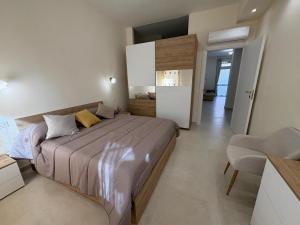 a bedroom with a large bed in a room at Residenza Orchidea in Tarquinia