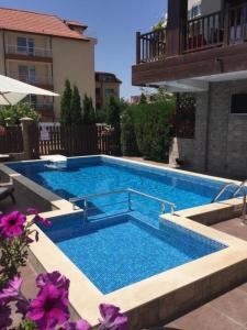 a swimming pool in the middle of a building at The White Houses 7 in Nesebar