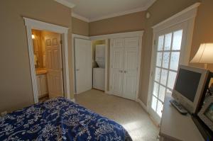 a bedroom with a bed and a tv in it at Pier Harbor #1 in Saint Ignace