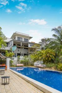 an exterior view of a resort with a swimming pool at 9 Bedroom Villa Mui Ne With Private Pool in Mui Ne
