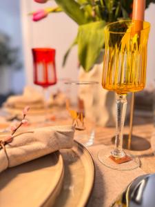 a table with a wine glass on top of it at Zeile Zwei - Kloster Zinna in Jüterbog