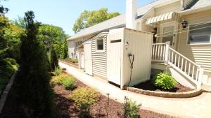 a house with a white door and a porch at Summer Breeze in Cape May Point