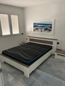a bedroom with a large bed in a room at La Maison italienne in Tangier