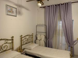 Ένα ή περισσότερα κρεβάτια σε δωμάτιο στο Fair Heaven Villa