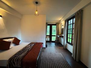 Ένα ή περισσότερα κρεβάτια σε δωμάτιο στο The Urban Hideout