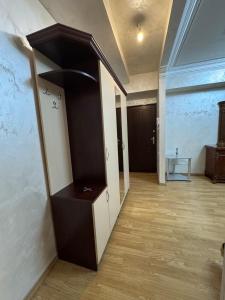 a room with a hallway with a desk and a wall at Apartment in Republic Square in Yerevan