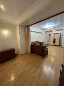 a large living room with a couch and a table at Apartment in Republic Square in Yerevan