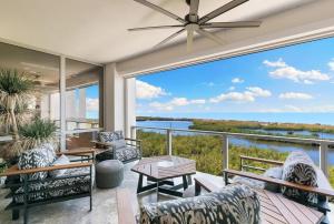 a living room with a view of the ocean at Smart-home & Panoramic Water Views in Naples