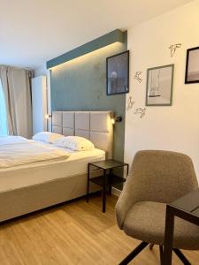 Postel nebo postele na pokoji v ubytování Zentrales Studio-Appartment mit Terrasse