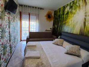 Ένα ή περισσότερα κρεβάτια σε δωμάτιο στο Venice Holiday Apartment