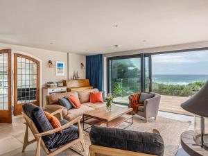 a living room with a view of the ocean at Blue Seas in Mawgan Porth