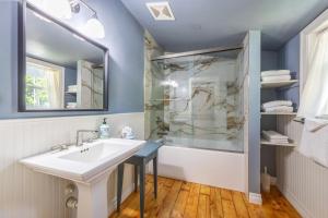 a bathroom with a sink and a shower at Grandview Get-A-Way in White Salmon +35 photos