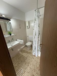 a bathroom with a toilet and a sink at FEWO mit Balkon in Osnabrück