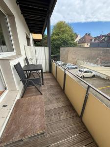 a balcony with a chair and a table on it at FEWO mit Balkon in Osnabrück