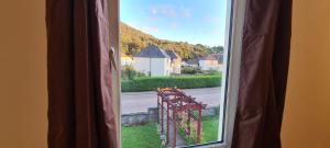 a window with a view of a street at Nevis Bank Studio in Fort William