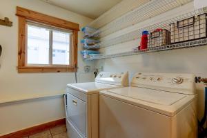 a laundry room with a washer and a window at The Bend House in Bend +28 photos