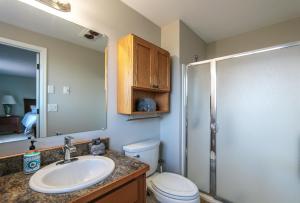 a bathroom with a sink and a toilet and a shower at Quail On Sunset in Hood River +27 photos