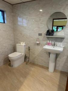a bathroom with a toilet and a sink and a mirror at Chaweng Bliss Bungalow in Chaweng +37 photos