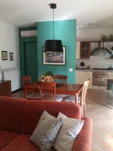 a living room with a red couch and a table at Umbriahouse in Terni