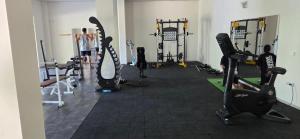 a gym with several tread machines and people in it at Studio F210 - Bulharsko in Aheloy