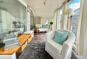 a living room with a couch and a table at Westerwald Hideaway 