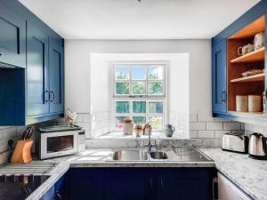 Kuchyň nebo kuchyňský kout v ubytování Mains Side - Uk47964