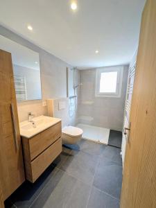 a bathroom with a sink and a toilet at Ferienwohnung Rosenburg in Randa +15 photos