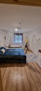 a bedroom with a bed and a tent at The Cottages - Pet Friendly in Meißendorf