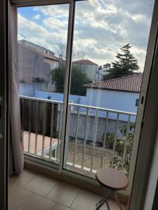 a view from a window of a balcony at Studio Emilie in Balaruc-les-Bains