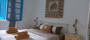 Ένα ή περισσότερα κρεβάτια σε δωμάτιο στο Cristal Majorelle à sidi Bou said