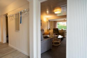 a living room with a couch and a table at Haus Sonnenwinkel Ina in Dahme