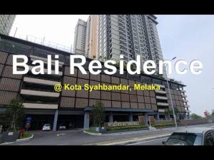a large building with a sign for ball residence at Bali Residence 6 Pax Family Unit in Melaka