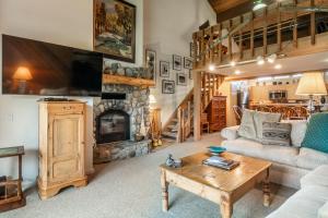 a living room with a couch and a fireplace at 3 Bedrooms + Loft townhome in Snowcreek Phase 3, Private Pool Table Sleeps 6 Guests, Dog Friendly in Old Mammoth