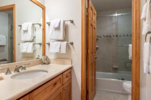 a bathroom with a sink and a toilet and a shower at 3 Bedrooms + Loft townhome in Snowcreek Phase 3, Private Pool Table Sleeps 6 Guests, Dog Friendly in Old Mammoth +33 photos