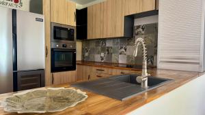 a kitchen with a sink and a counter top at Malora Beach in Le Moule