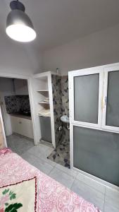 a room with a room with a bed and a room with a room at la petite sirène in Mahdia