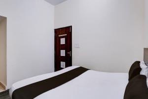 Katil atau katil-katil dalam bilik di Hotel O Krishna Villa