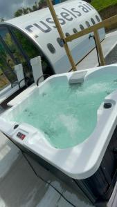 a bath tub in the back of a boat at AeroHeaven Glamping in Cavan
