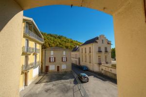 a view from a window of a street with buildings at Appartement rénové avec 2 chambres et espace bien-être Lavelanet in Lavelanet