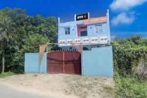 a building with a gate in front of it at spot On Happy Awashi Hotel in Patna City +21 photos